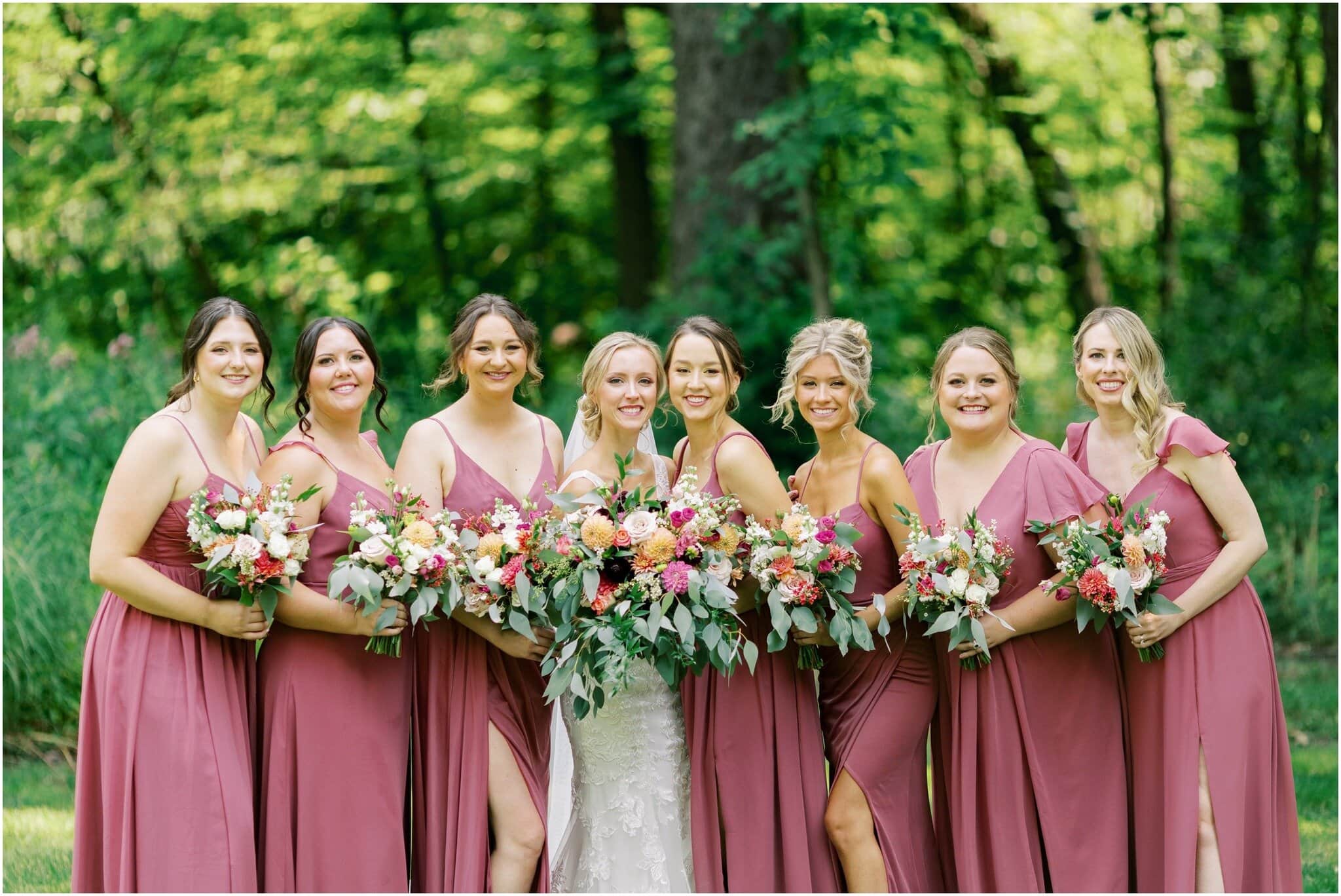 Full bridal party displaying florals by Art in Bloom Floral Studio in Howell, Michigan.