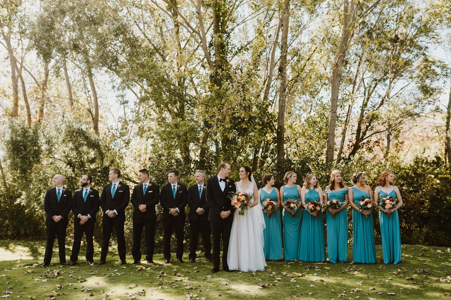 Full wedding party displaying florals by Art in Bloom Floral Studio in Howell, Michigan.