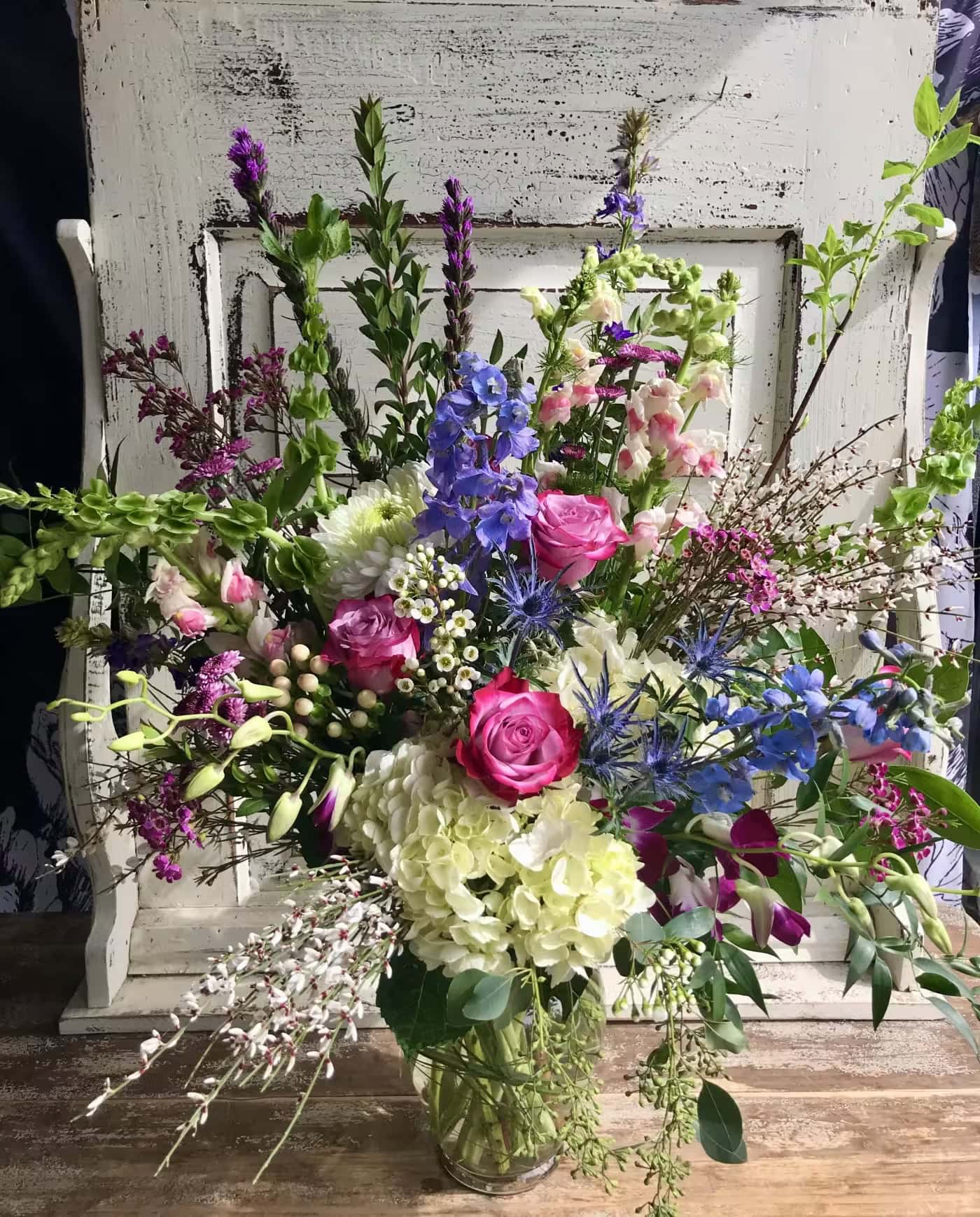 A grand arrangement of hydrangea, delphinium, roses and more from Art in Bloom Floral Studio in Howell, Michigan.