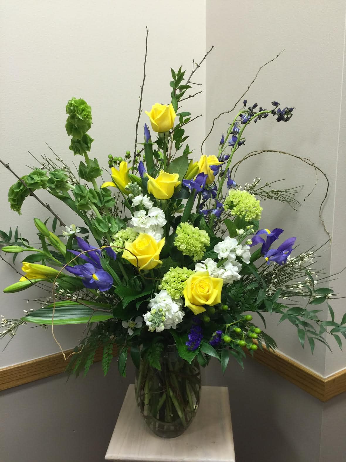 Irises-Yellow-Roses A floral arrangement from Art in Bloom Floral Studio in Howell, Michigan.