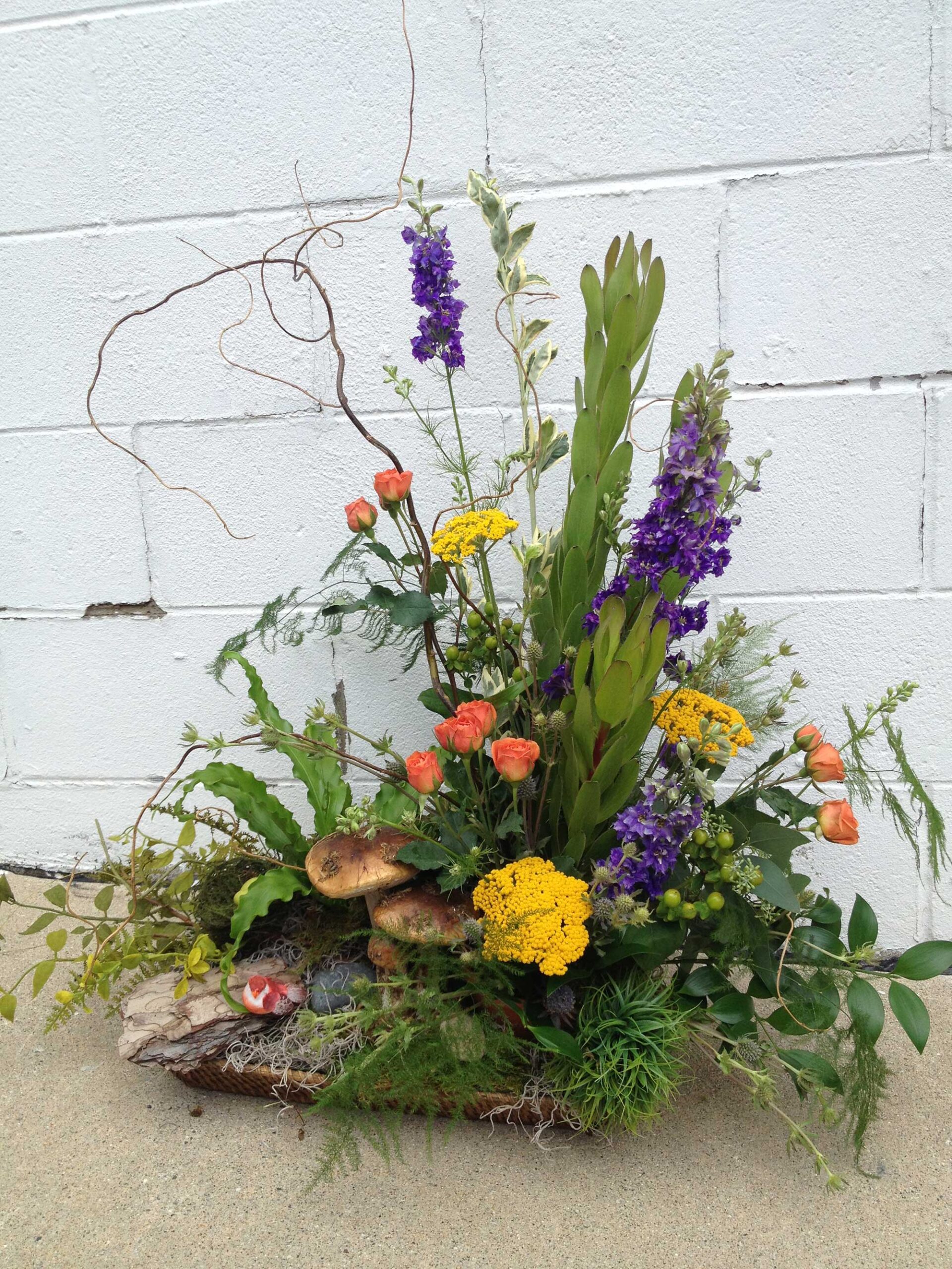 Natural design with mushrooms A floral arrangement from Art in Bloom Floral Studio in Howell, Michigan.