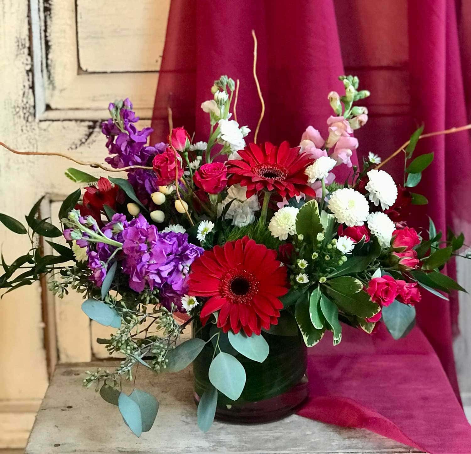 A bright arrangement in reds, purples, pinks and white from Art in Bloom Floral Studio in Howell, Michigan.